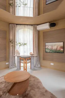 a living room with a table and a window at Unique 3 floor apartment with AC at Westerpark in Amsterdam