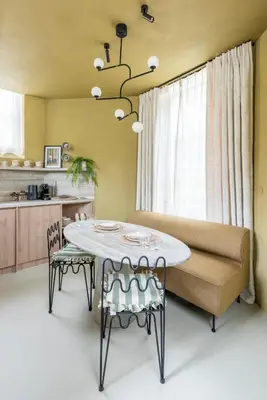 a dining room with a table and a couch at Unique 3 floor apartment with AC at Westerpark in Amsterdam