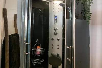 a metal elevator with a sticker on the side of it at Guesthouseamsterdam in Amsterdam