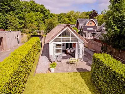 an overhead view of a small house with a garden at Dune Haven in Schoorl