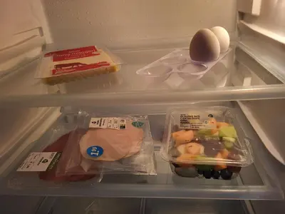 an open refrigerator with some food in it at De Gortla in Oosterblokker