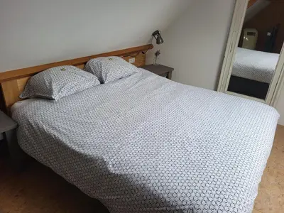 a bed with two pillows on it in a bedroom at De Gortla in Oosterblokker