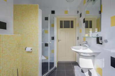 a bathroom with a sink and a shower at Ruime vakantievilla in Zeewolde in Zeewolde
