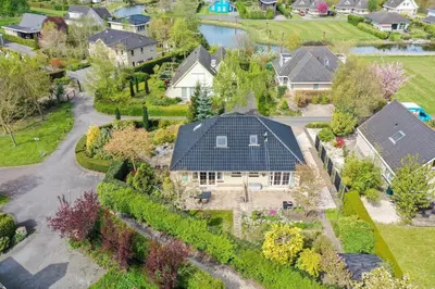 an aerial view of a house with a roof at Ruime vakantievilla in Zeewolde in Zeewolde