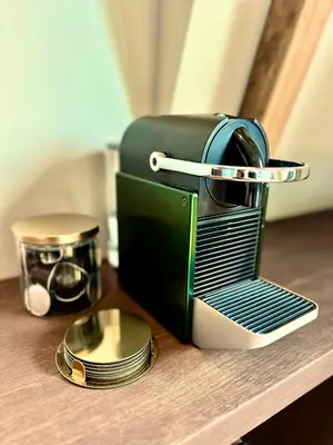 a black and green appliance sitting on a table at Rembrandt & Vermeer in Amsterdam