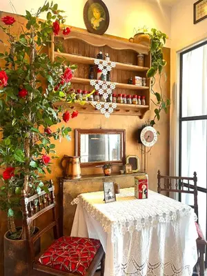 a dining room with a table and a plant at Canal House with a Unique View in Amsterdam