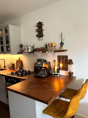 a kitchen with a wooden counter top in a kitchen at Canal House with a Unique View in Amsterdam