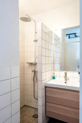 a bathroom with a sink and a shower at Apartment Hotel Zuid Oost Heesterveld BnB ZOH in Amsterdam