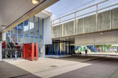 a building with a red phone booth in front of it at Apartment Hotel Zuid Oost Heesterveld BnB ZOH in Amsterdam