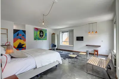 a bedroom with a bed and a table and chairs at Apartment Hotel Zuid Oost Heesterveld BnB ZOH in Amsterdam