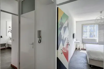 a white room with a bed and a window at Apartment Hotel Zuid Oost Heesterveld BnB ZOH in Amsterdam