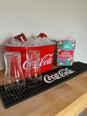 a counter with two glass vases and a basket of soda at Luxury Private Spa with golden bath, cinema and sauna in Bodegraven