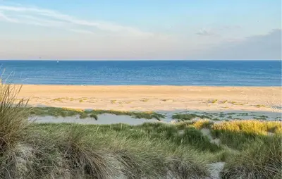 a sandy beach with the ocean in the background at 1 Bedroom Lovely Home In Heiloo in Heiloo