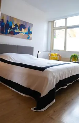 a large bed in a room with at Verdronkenoord57 in Alkmaar