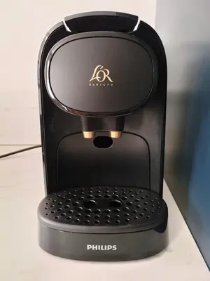 a black coffee maker sitting on a counter at Het Haven Huysje in Hoorn