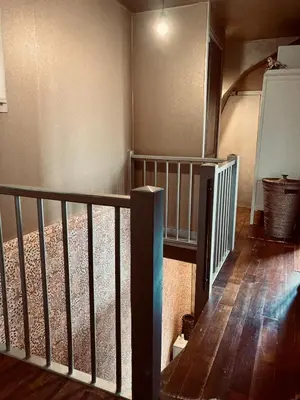 a staircase in a house with a stair railing at Cosy real Dutch family house anno 1910 in Alkmaar