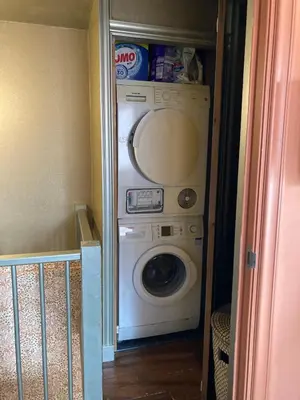 a washer and dryer in a small room at Cosy real Dutch family house anno 1910 in Alkmaar