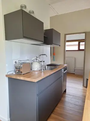 a kitchen with a sink and a counter top at Rekerlanden 86 in Warmenhuizen