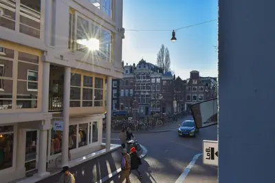 a view of a city street with people and buildings at NEW cosy apartment in 9 streets in Amsterdam