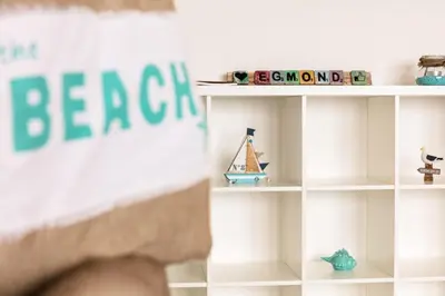 a toy shelf with a toy boat on it at Strand166 in Egmond aan Zee