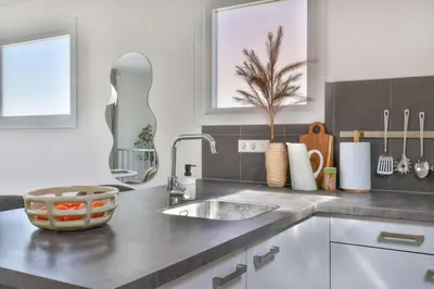 a kitchen with a sink and a counter top at City apartment Alkmaar in Alkmaar