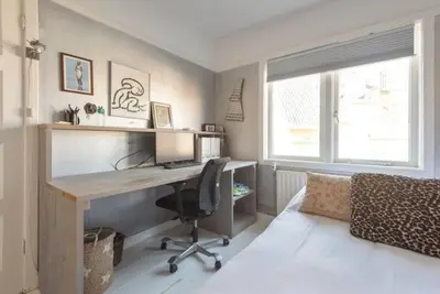 a home office with a desk and a computer at Beachhouse36 in Zandvoort