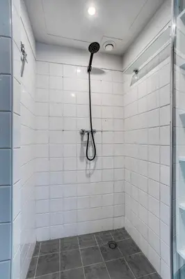 a bathroom with a shower with a shower head at Authentic apartment in Alkmaar in Alkmaar