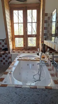 a large bathroom with a tub in a room at A B&B Amsterdam in Amsterdam