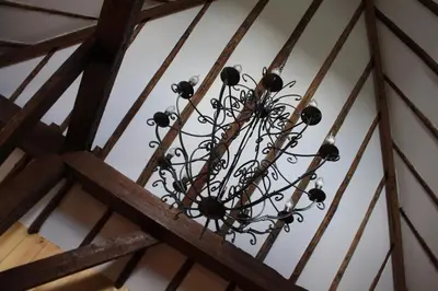 a chandelier hanging from the ceiling of a building at Bed & Breakfast De Stolp in Zuidoostbeemster