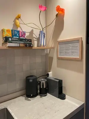 a kitchen counter with a coffee maker and a toaster at B&B Goldie in Aerdenhout