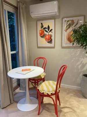 a table and two chairs and a white table and chairs at B&B Goldie in Aerdenhout