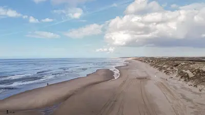 an aerial view of a sandy beach with the ocean at Garnekuul 34 in Ons Belang