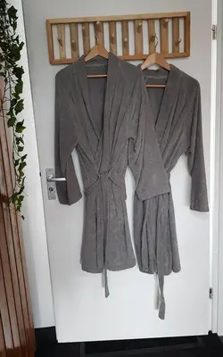 a jacket and trousers hanging on a door at B&B Purmavida in Purmerend