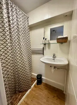 a bathroom with a sink and a mirror at Cozy Apartment in Aalsmeer in Aalsmeer