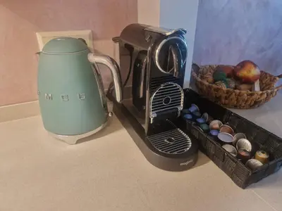 a coffee maker sitting next to a basket of eggs at Modern and cozy, top location in Amsterdam