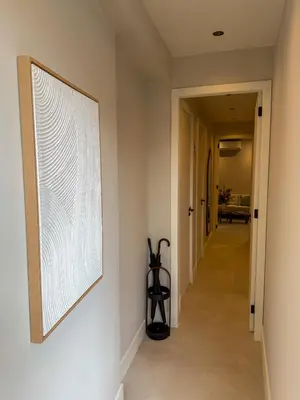 a hallway with a large painting on the wall at B&B De Amsterdamse Poort in Haarlem