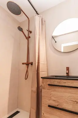 a bathroom with a shower and a sink at B&b aan zee in Egmond aan Zee