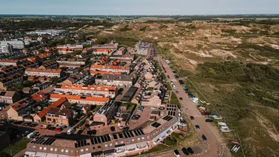 an aerial view of a city with buildings at B&b aan zee in Egmond aan Zee