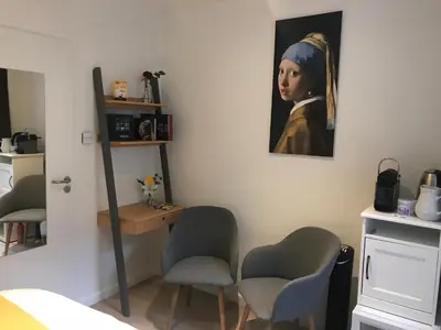 a room with a painting of a girl with a follower at Rust B&B in Amsterdam
