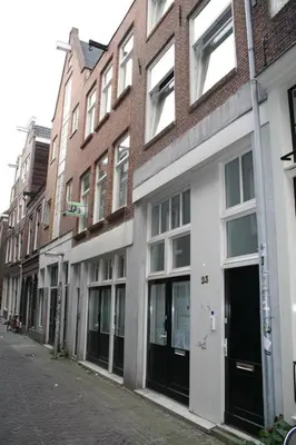 a row of buildings on a city street at Rust B&B in Amsterdam
