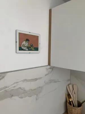 a white marble counter with a picture on the wall at Studio South Beach II with free parking in Zandvoort
