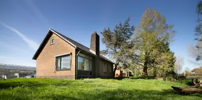 a house sitting on top of a grassy hill at NEW! Nightglow Residency in Oosteinde