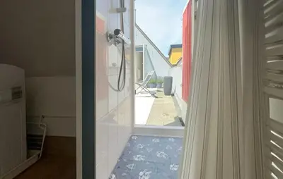 a view of a bathroom with a shower and a window at 1 Bedroom Awesome Home In Katwijk Aan Zee in Katwijk aan Zee