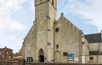 an old stone church with a tall tower at 1 Bedroom Awesome Home In Katwijk Aan Zee in Katwijk aan Zee
