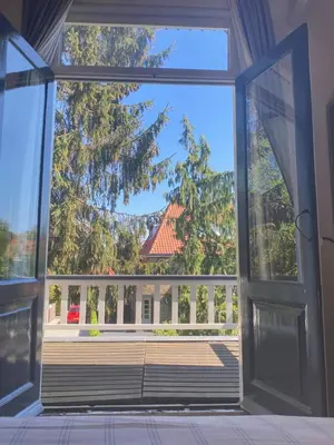 an open door with a view of a house at Authentic villa near Amsterdam and nature in Ons Belang