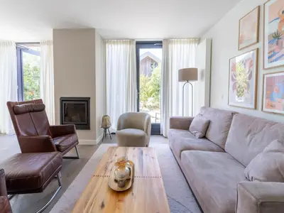 a living room with a couch and a coffee table at Villa in Egmond near Beach & Windmill in Egmond aan den Hoef