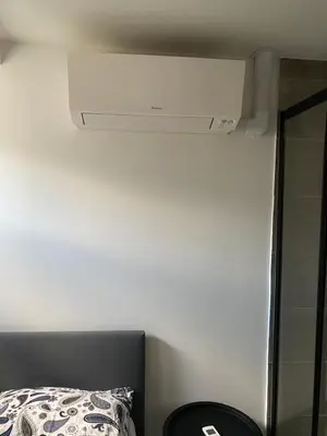 a ceiling fan in a room with a bed at Rooftop Terrace Apartment in Amsterdam