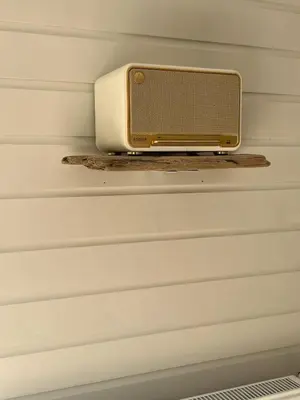 a television on a shelf in a wall at Zandvoort Boutique Apartments in Zandvoort