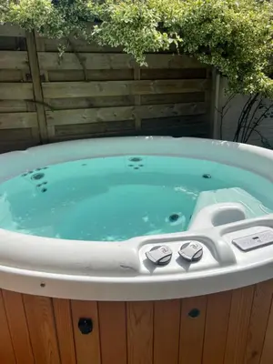 a jacuzzi tub sitting in a yard at Zandvoort Boutique Apartments in Zandvoort