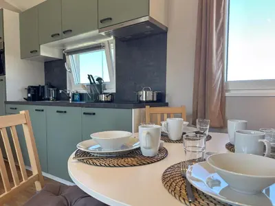 a kitchen with a table with dishes on it at Fuut 24-28 in Breukelen